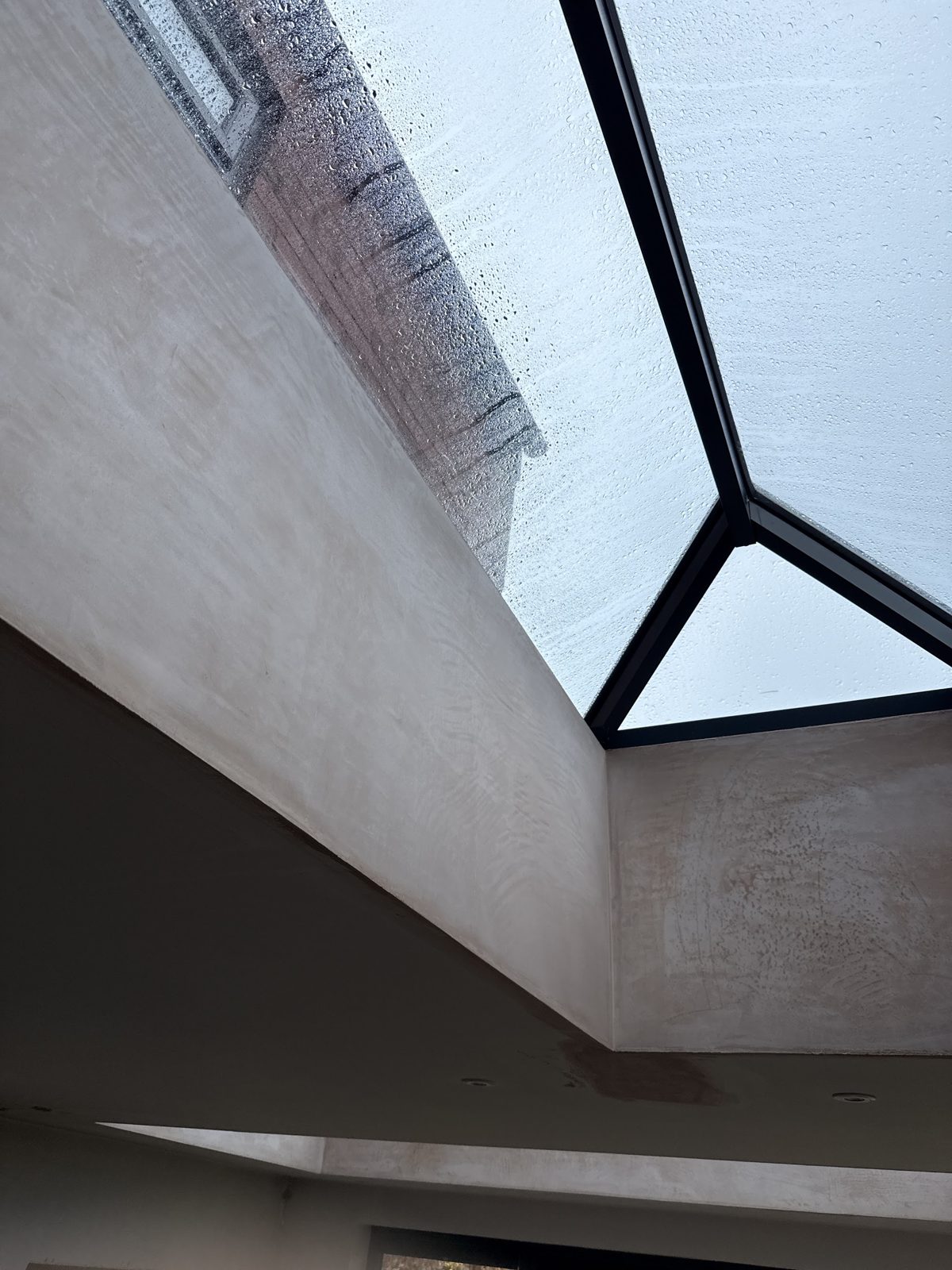 Freshly plastered reveal around a glazed lantern roof